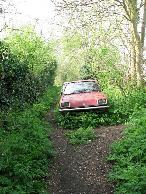 Abandoned cars Looking in the opposite direction the path here joins the