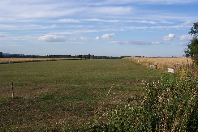 The landing strip is adjacent to the old Horsham to Guildford railway line 