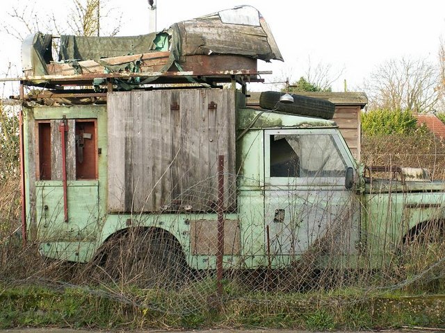 This old Land Rover is very well equipped and comes complete with small boat