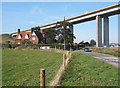 B1456 and house dominated by the western end of the Orwell Bridge