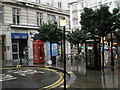 Contrasting phone boxes in Southampton Street