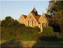 SU8404 : Fishbourne church in the setting sun by Nick Smith
