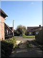 Looking across Garsons Road from the footpath from Tuppenny Lane