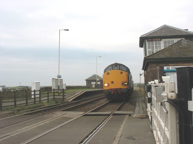 The DRS Class 37/6 diesel  tractor  37609 thundering through Ty Croes Station