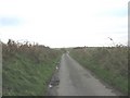 Road north towards the railway line and Rhosbadrig