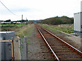 The view west toward Pwllheli along the Cambrian Coast Line from Abererch Level Crossing