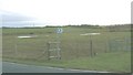 Footpath and waterlogged farmland south of the A 4080