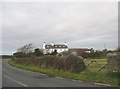 The farmhouse of Siop Farm located at a sharp bend in the A 4080