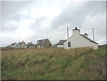 SH3371 : Ty'n Towyn and neighbouring bungalows. by Eric Jones