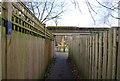 Arched entrance to The Grove from Bird Cage Walk