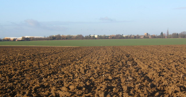 Ploughed field and view of Wattisham Air Base