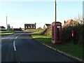 ST8703 : Thornicombe: postbox № DT11 16 and phone by Chris Downer