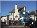 Fishing boat pulled up by the Cobb Arms