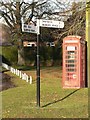 Sturminster Marshall: phone box and signpost