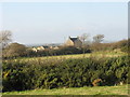 The farmhouse of Tyddyn Harri farm viewed from the A 4080