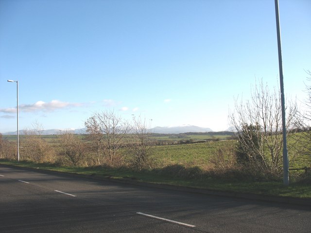 View SE across farmland from the Bryn Cefni Industrial Estate access road
