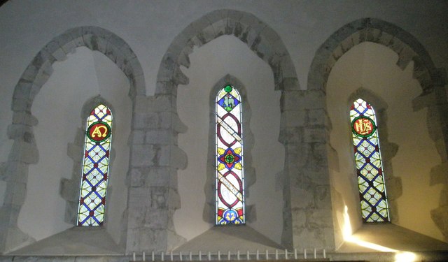 Stained glass windows above the altar at St Peter, East Marden