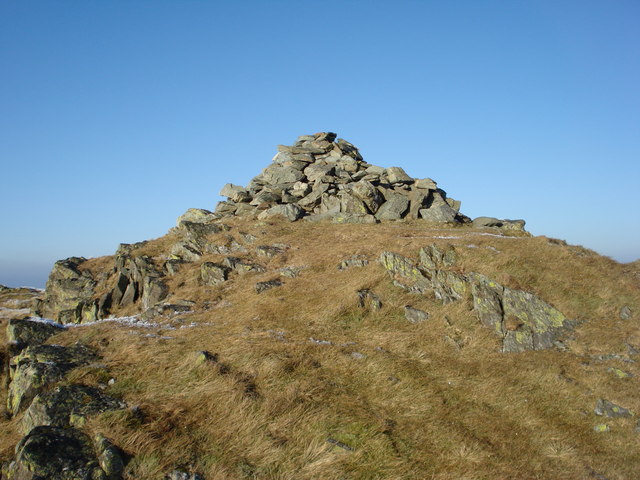 The summit cairn of Y Garn on a sunny winter's day