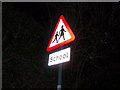 School sign in Church Street, Isham