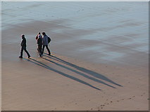 NG8075 : Walkers on Gairloch beach, midday New Year's Day 2009 by Dave Marley