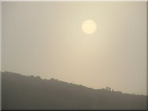 NS2471 : Hazy sunset over Crawhin Hill by Thomas Nugent