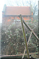 Discarded Farm Equipment and Brick Building