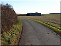 Road and barn near Grove Wold Farm