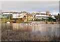 Two rowing eights racing down the River Dee