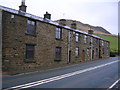 Terrace of houses in Turn on the busy A680