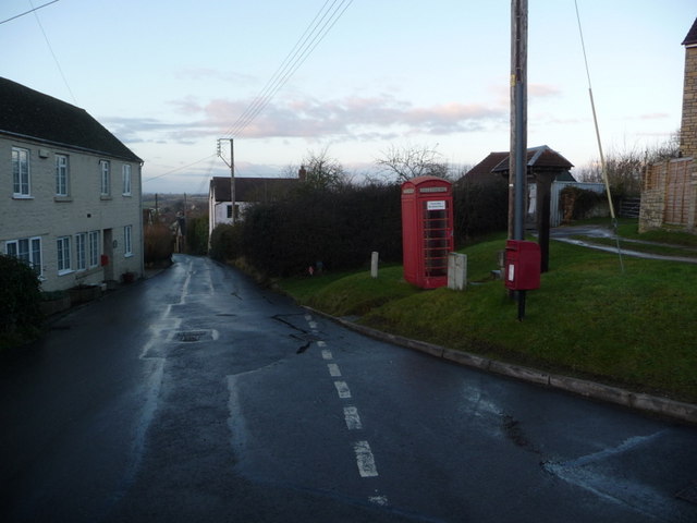 Broad Oak: postbox № DT10 72 and phone box