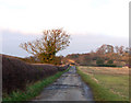 SP3967 : Metalled farm track, near Eathorpe by Andy F