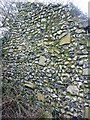 End wall in derelict building in churchyard