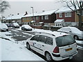 A snowy scene in Elkstone Road