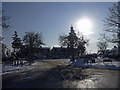 Junction of Lonsdale Drive/Merryhills Drive with Bramley Road, Enfield