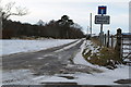 Snow covered road leading to Milton of Balhall