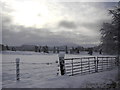 NH8910 : Snowy gate near Inverduie House by Peter Bond
