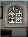 Intricate stained glass window on the south wall of St John the Baptist, Windsor