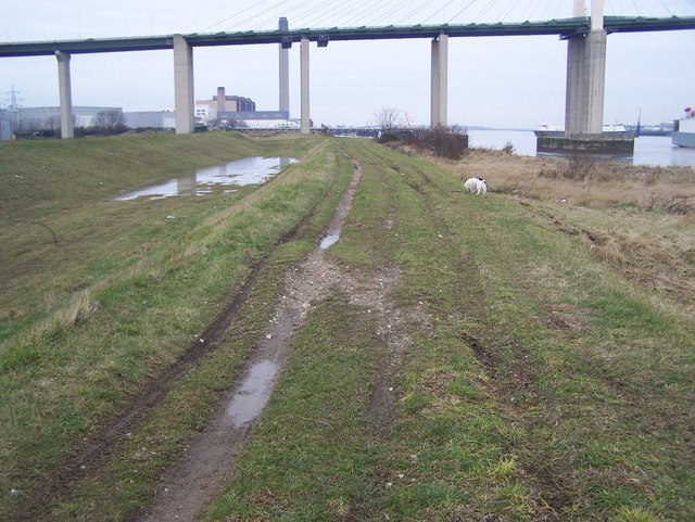 Footpath on sea wall, heads under bridge
