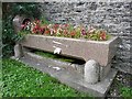 Drinking trough full of flowers