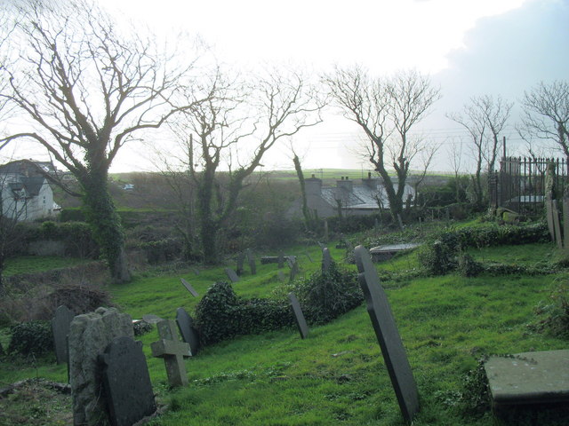 Old graves at Llanfaelog Parish Church by Eric Jones