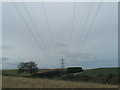 NU0022 : Electricity lines spanning the Lilburn Burn near Ilderton by ian shiell