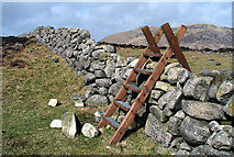 J2922 : Stile and dry stone wall near Slievenaglogh by Rossographer