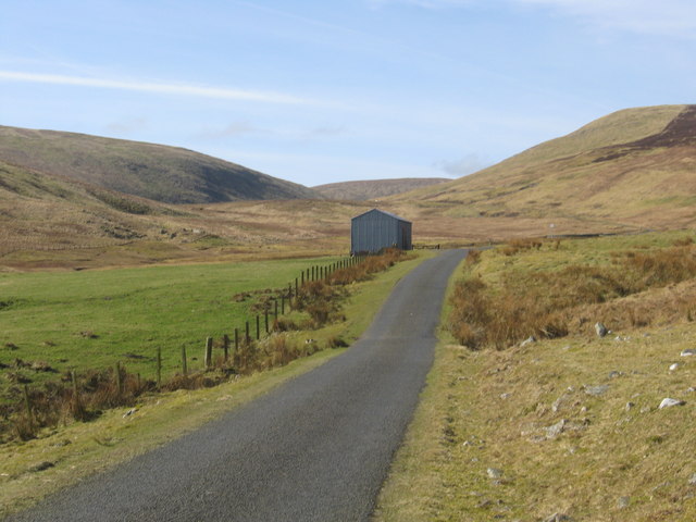 A solitary farm building in the hills