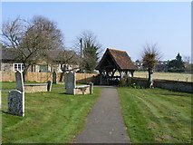TL7924 : Churchyard and Gate by PAUL FARMER