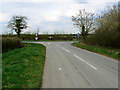 Minor road junction with B4040 near Stonehill Wood