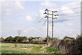 Power lines on posts near the River Ock