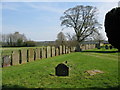 TR1144 : Gravestones line the perimeter of Elmstone churchyard by Nick Smith