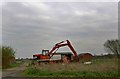 Digger and disused buildings, Bawtry Road, Hatfield Woodhouse