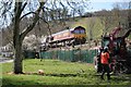 Train and tractor in the park.