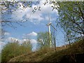 A single wind turbine looms over the Trans Pennine Trail